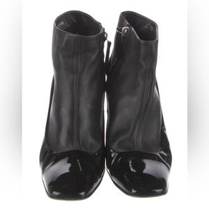 Black leather booties with patent leather